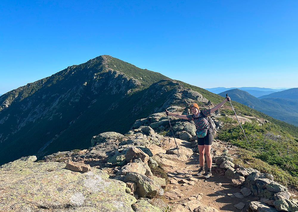 abby evans hiking solo on a mountain range