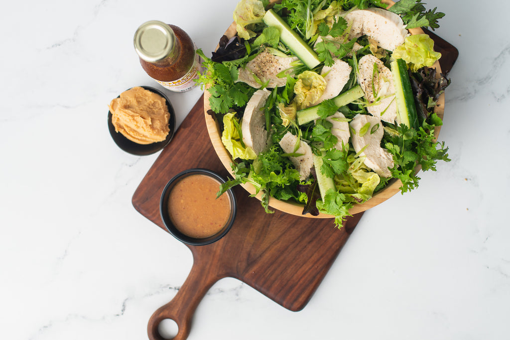 Top down view of chicken salad with miso dressing