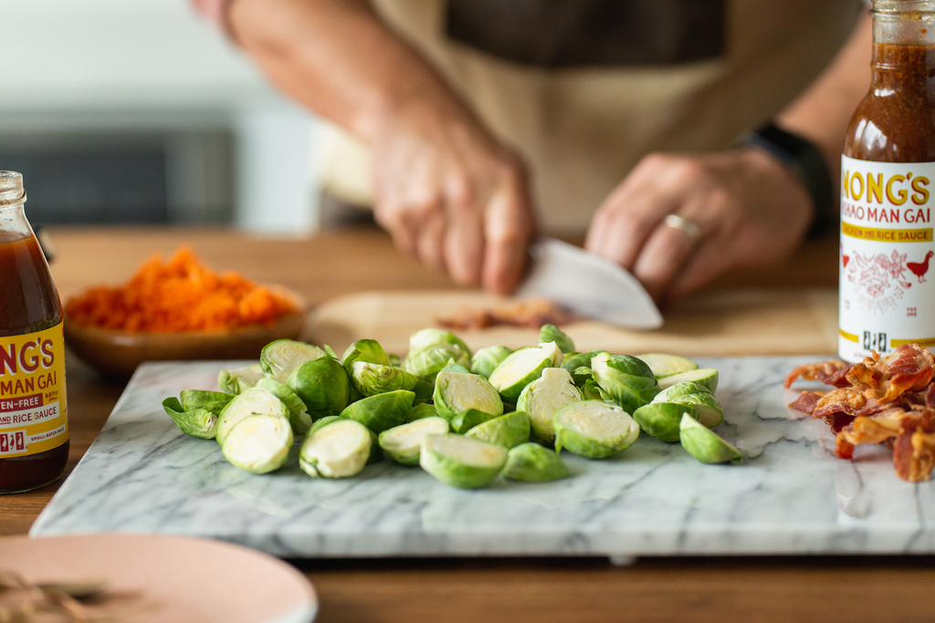 Chef preparing bacon and brussels sprouts.