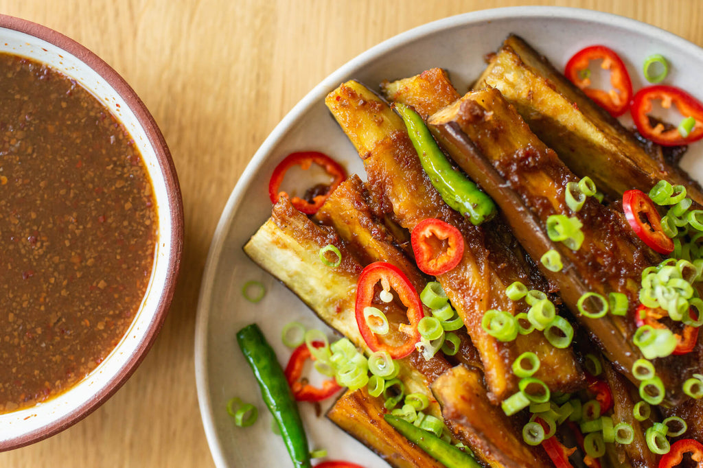 Close up of stir-fried dish and Nong's sauce. 