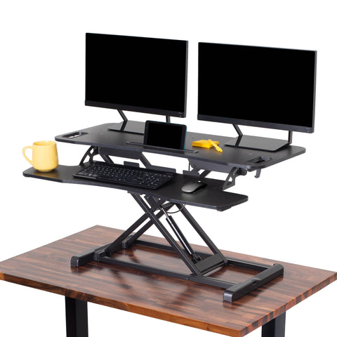 The FlexPro Hero standing desk converter by Stand Steady.