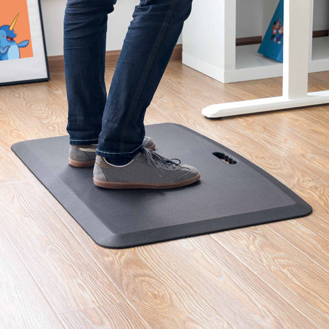 Add a standing mat to your standing desk for a more ergonomic workday.