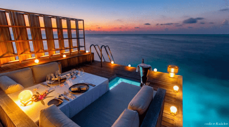 Candle light dinner sitting in the overlooking the ocean in Maldives