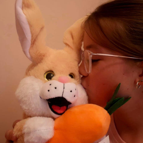 Children with a musical bunny toy