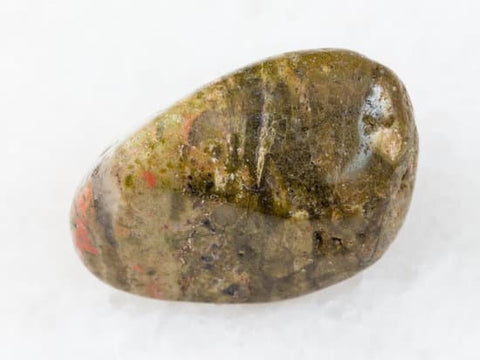 A beautiful Unakite crystal, showcasing its unique combination of pink and green colors, symbolizing balance, emotional healing, and harmonious relationships.