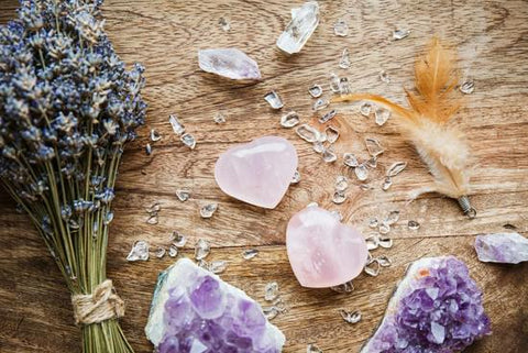 A collection of love crystals, including Rose Quartz, Rhodochrosite, and Rhodonite, radiating gentle energy of love, compassion, and emotional healing.