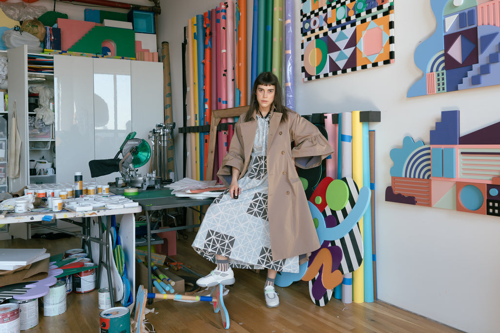Leta Sobierajski in her studio wearing the Seek Collective Goa Dress and her own trench coat