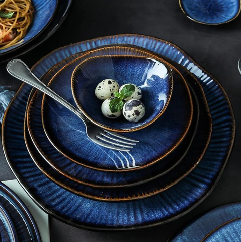 Blue porcelain bowls piled up on top of each other.