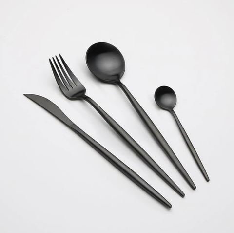 Luxurious Cutlery Sets | Black cutlery set on a white table.