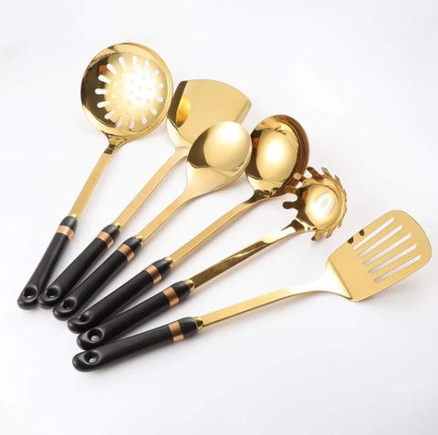 Luxurious utensils | Golden utensils set with black handles.