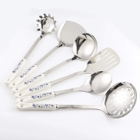 Luxurious Utensils | Silver utensils set with white flower handles.