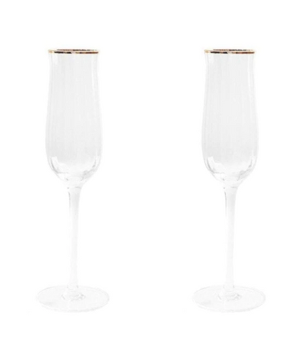 Champagne Glasses | Two elegant handmade crystal champagne glasses next to each other.