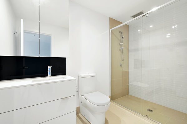 windowless all-white bathroom