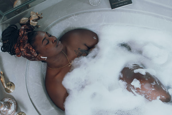 beautiful woman having a relaxing bubble bath 