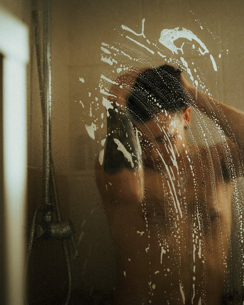 blurred photo of man taking a shower