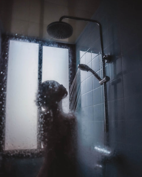 silhouette of a woman taking a shower