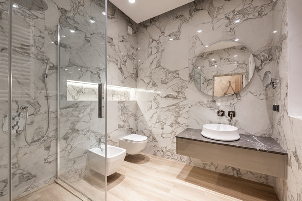 bathroom with marble walls