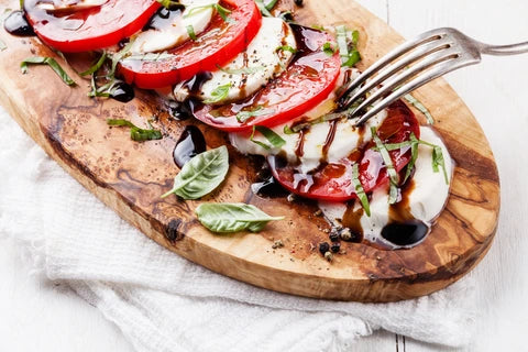 Try a Grapefruit + Hibiscus Plenty Hard Kombucha with a caprese salad.