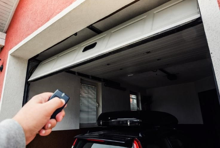 Handheld remote controller opening a garage door