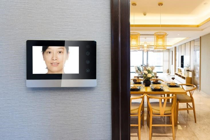 Indoor intercom video showing a woman’s face