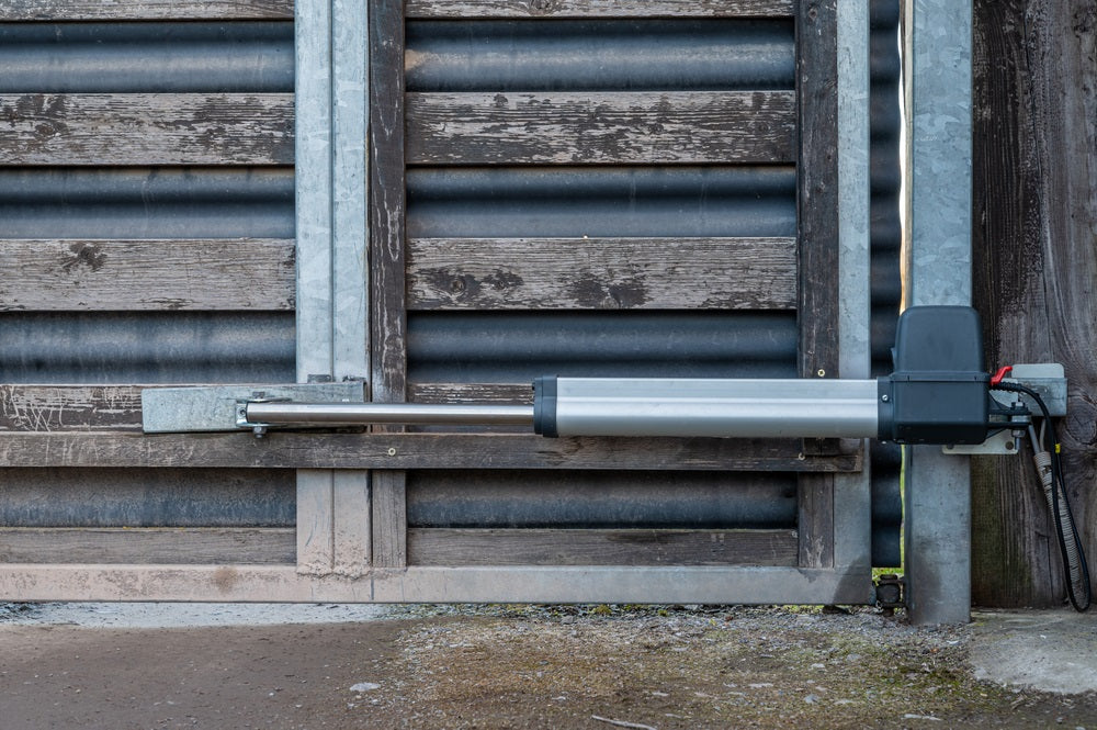 swing gate operator on a large gate at the entrance to a property