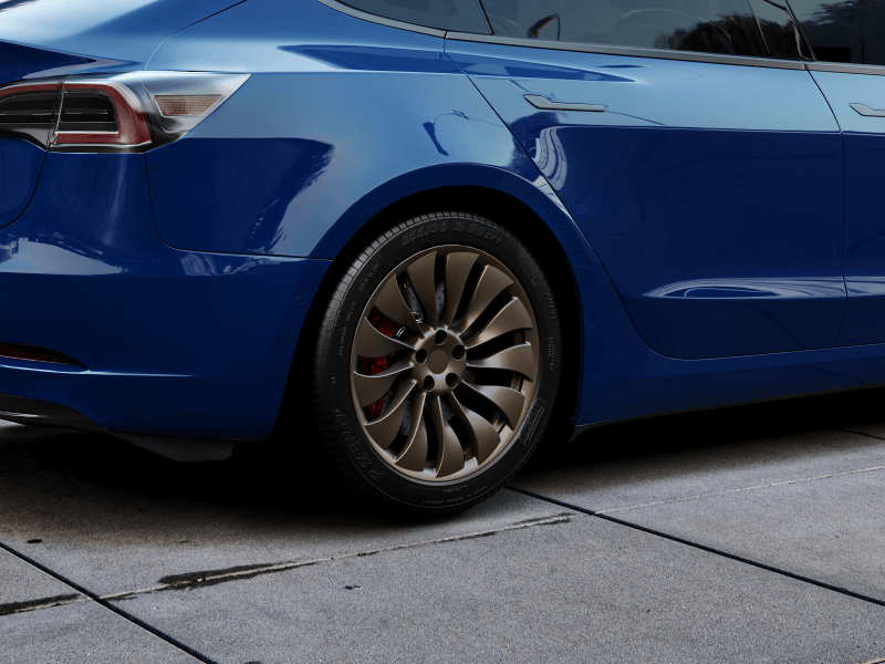 19″ ENTERPRISE Fully-Forged Wheel for Tesla Model 3 - Borealis Bronze custom aftermarket wheel on a blue Tesla Model 3