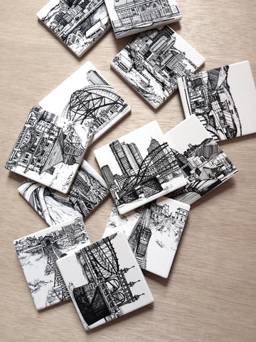 collection of coasters printed with different Pittsburgh architecture