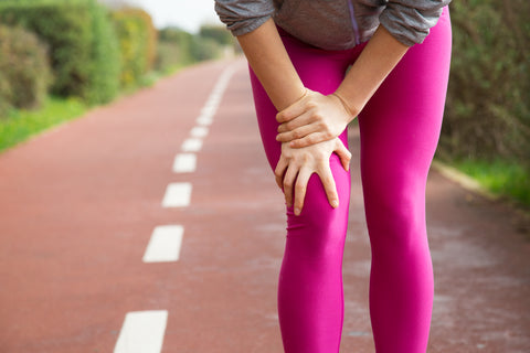 Women suffering from knee pain caused due to inflammation