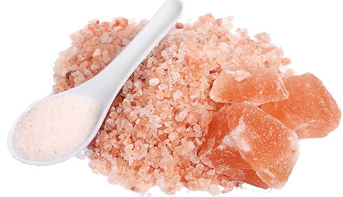 Image displaying Himalayan rock salt crystals. The crystals are translucent and vary in shades of pink and white, highlighting the natural beauty of this type of salt.