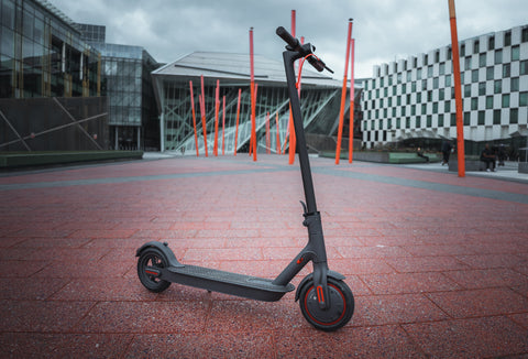 Xiaomi m365 electric scooter standing freely at the Docklands in Dublin.