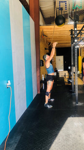 Female athlete dropping-in at SoWal CrossFit® in Santa Rosa Beach Florida, in South Walton County Florida.