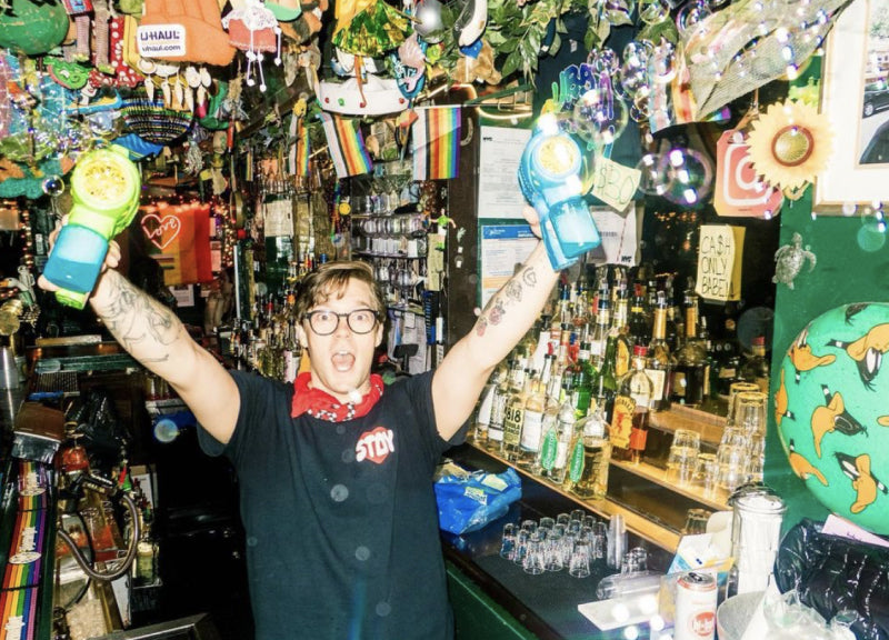 Bartender behind the bar at Cubbyhole NYC