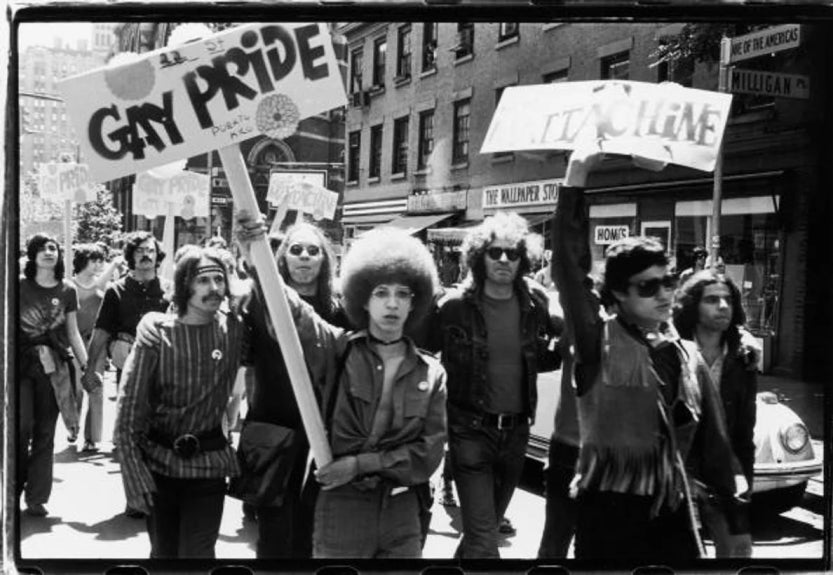 People hold 'Gay Pride' and 'Mattchine' (The Mattachine Society was a early American gay rights organization) signs during the first Stonewall anniversary march, then known as Christopher Street Liberation Day