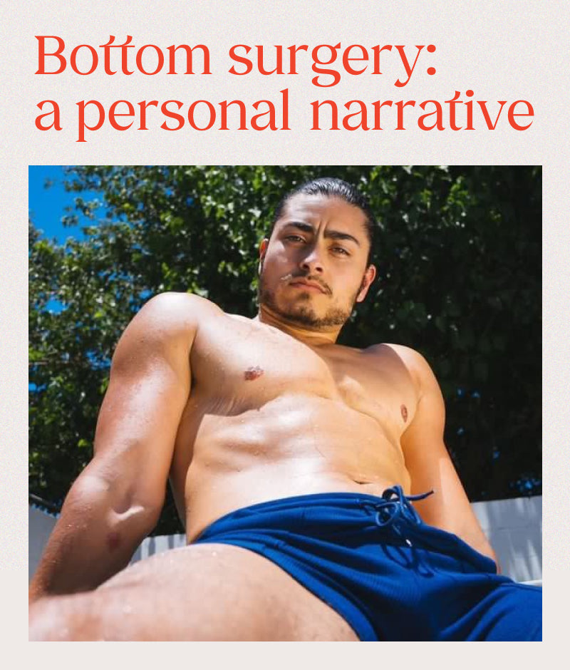 Trans man Emmett Preciado sitting outdoors in blue Elliot swimtrunks