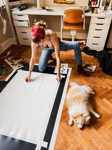 Artist Working in her Studio with her Dog