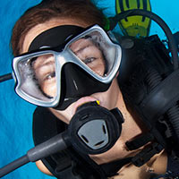 person in a mask and full diving equipment