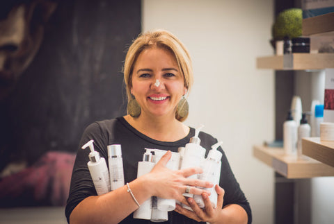 Ildiko Juhasz co-owner of revoderm holding products in her arms