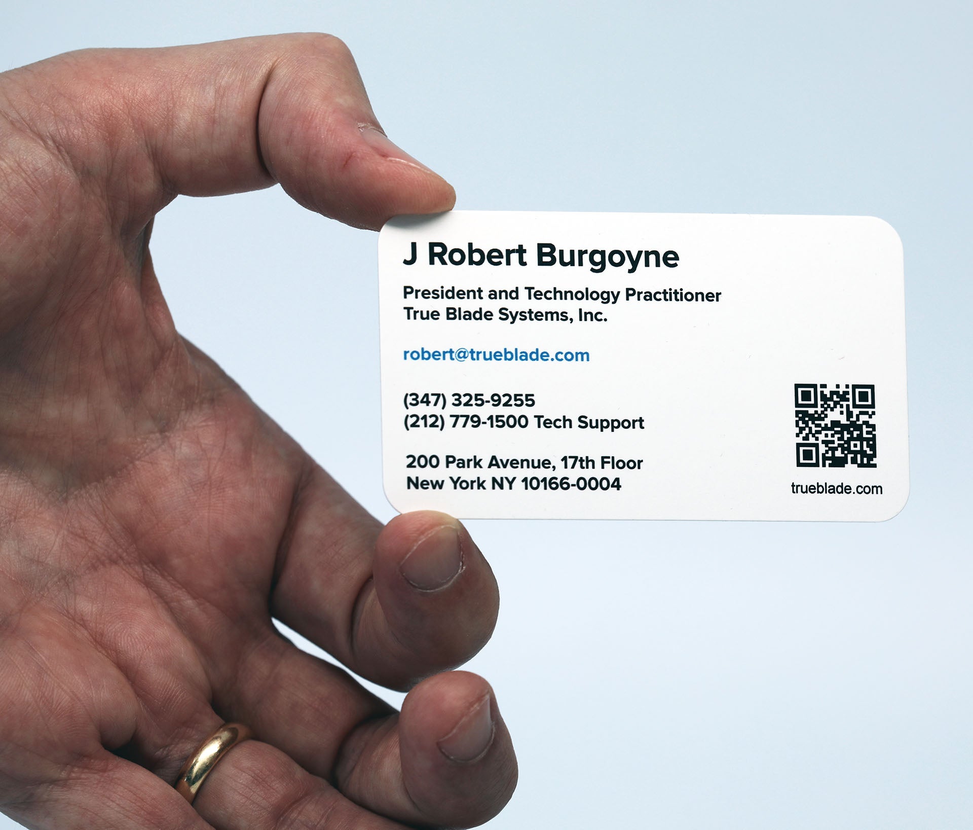J Robert Burgoyne holding his new business card