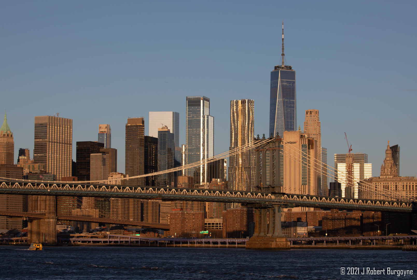 Image of Manhattan Bridge on the East River with skyscrapers in the background