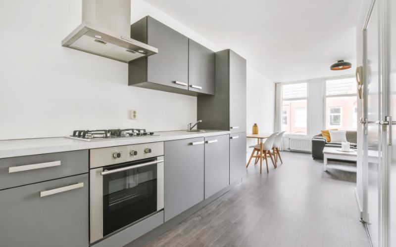 Stunning kitchen with Stone Gray cabinets and wall shelves