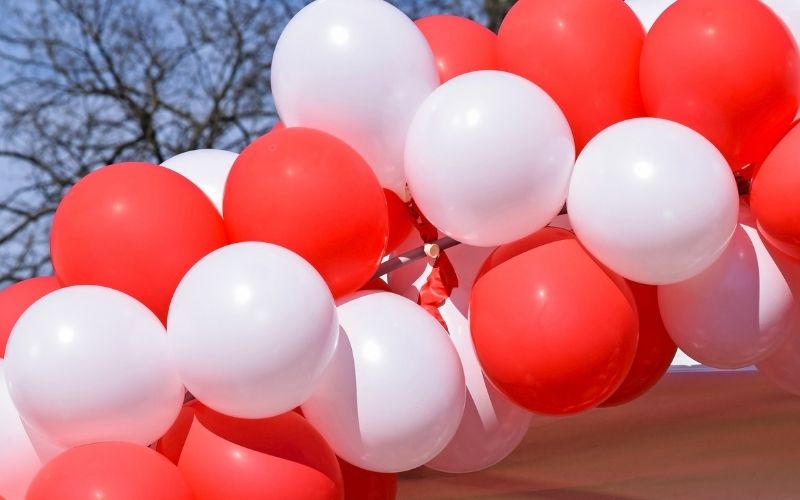 Red and white balloon arc