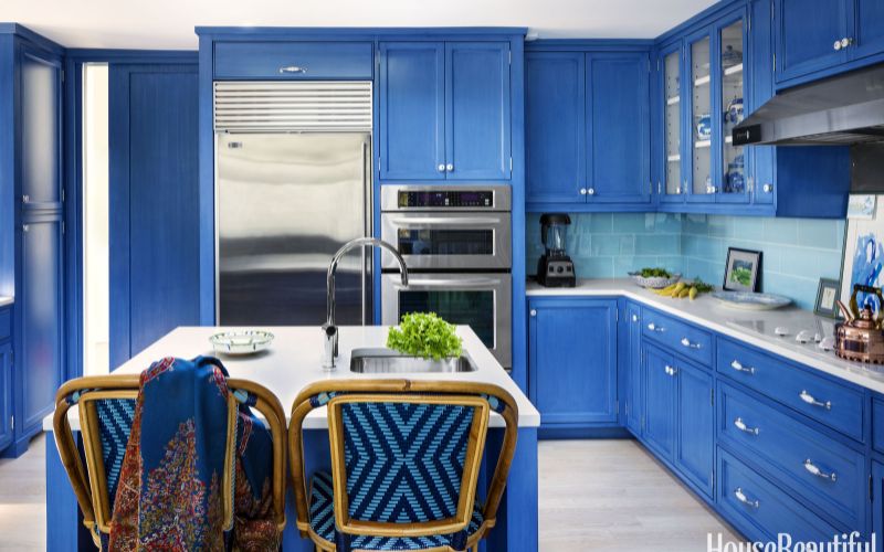 Cobalt blue cabinet and white kitchen - Image by House Beautiful