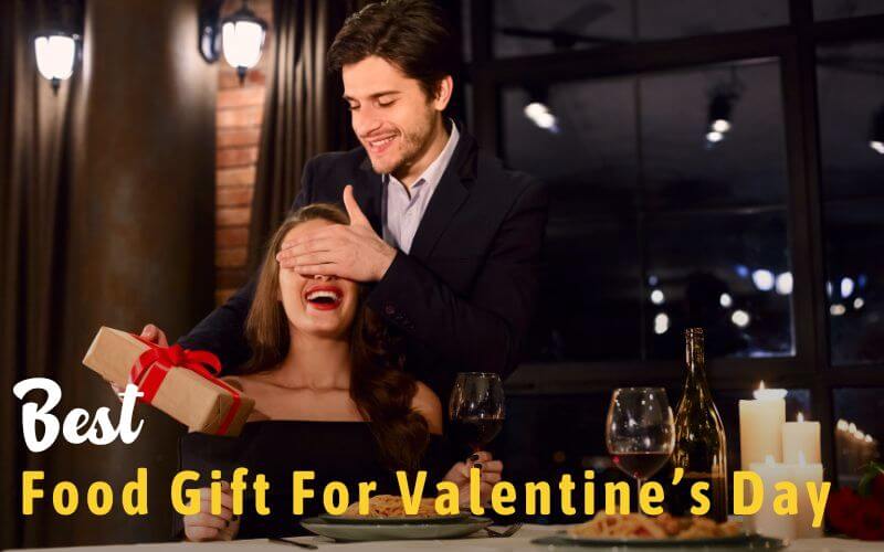 Man giving Valentine's Day Gift during dinner