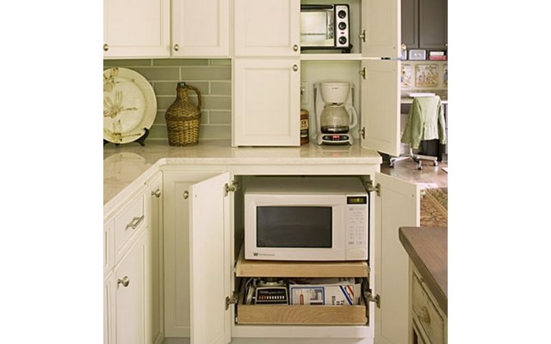 Microwave Pull-Out In An Undercabinet - Image by Shelterness