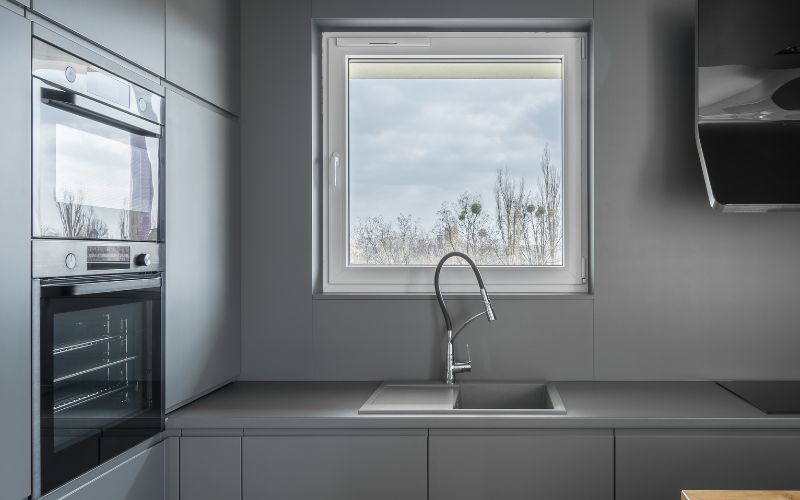 Shell gray kitchen with a small window