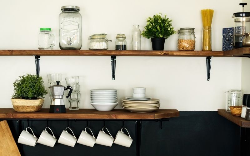 Dish and jars on open shelves