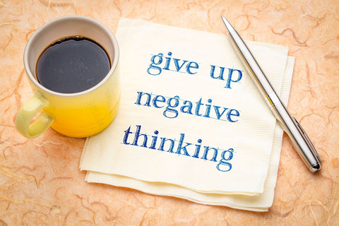 Be Active Maternity positive thinking blog post - napkin with writing "give up negative thinking"