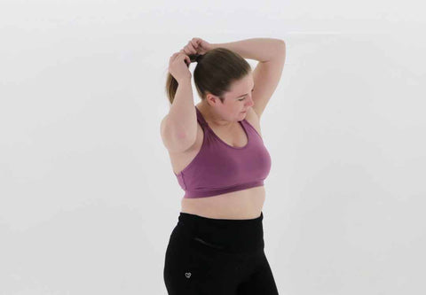 Woman wearing maternity and nursing sports bra