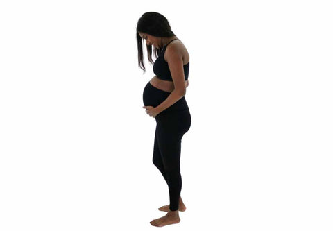 Pregnant woman wearing maternity workout leggings