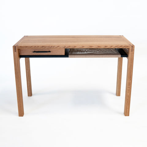 Kamehana Desk - Front View - White Oak body with Danish Cord shelf on right, slim drawer on left.
